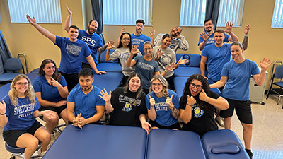 group of physical therapy students celebrating their new tables courtesy fo the SPC Titan Fund