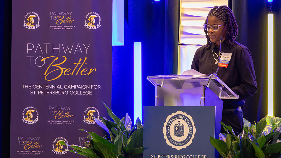 St. Petersburg College student and basketball player Celine Forine speaking at donors and scholars luncheon