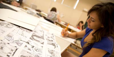 a student working at a drawing table.