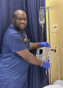 nursing student Darryl Benjamin working in the simulation room