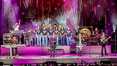 collegiate high school students performing with the band Foreigner in The BayCare Sound