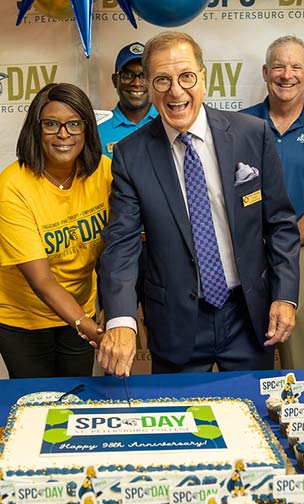 Tarpon Spring Mayor John Koulianos enjoying a cake cutting with SPC President Tonjua Williams at SPC Day 2025