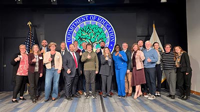 group shot of Department of Education staffers and St. Petersburg College President Dr. Tonjua Williams