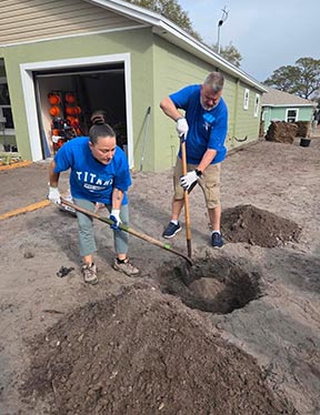 spc employee working on a habitat for humanity house