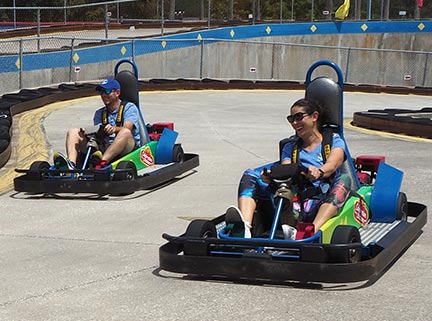 SPC staffers Carissa Roldan and Jason Nicholson racing in go carts