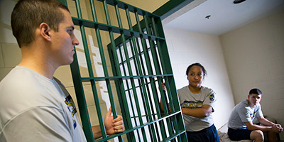 photo of students in a simuated jail environment