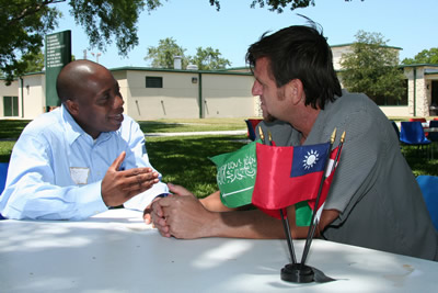 a student chatting with a tutor on campus