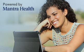 Mantra Health photo of a woman using her laptop for telemental heath service