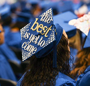 SPC female graduate with decorated cap