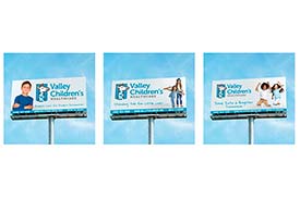 Student digital media project of a hypothetical billboard design for Valley Children’s Healthcare. Three billboards are shown. The billboard on the left features a little boy, the VCH logo, and a tagline that reads, Endless Care for Endless Possibilities. The billboard in the middle features two little girls holding hands, the VCH logo, and a tagline that reads, Standing Tall for Little Lives. The billboard on the right features a little boy and girl jumping in the air, the VCH logo, and a tagline that reads, Jump Into a Brighter Tomorrow.