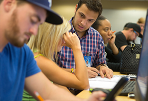 An instructor assisting a student.