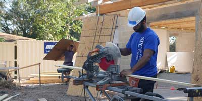 SPC volunteer working at a home construction site