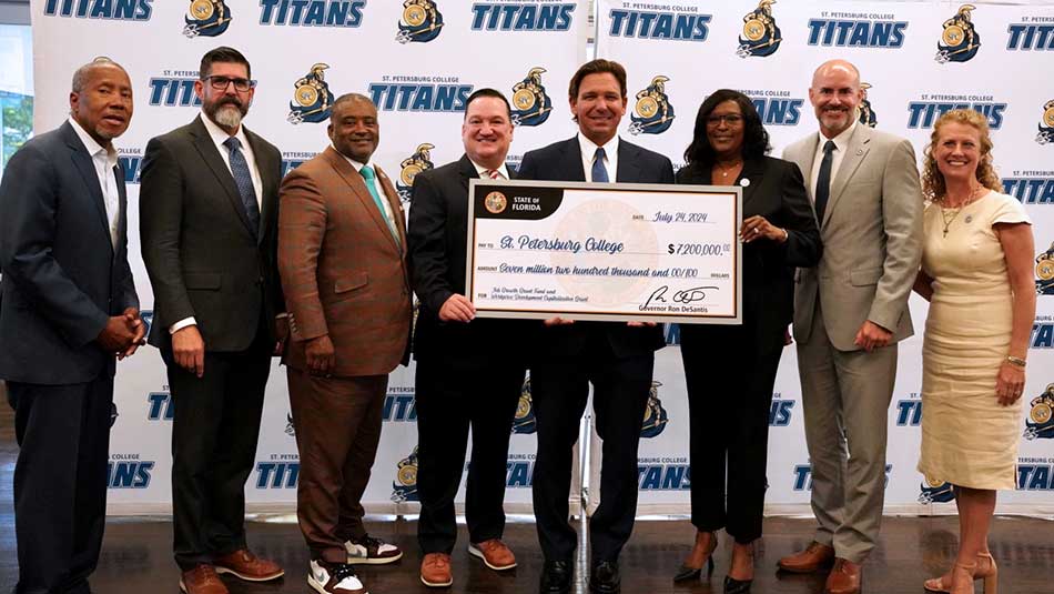 SPC BOT members and President Tonjua Williams post with Florida Gov. Ron Desantis