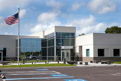 The SPC SPC Veterinary Technology Center beneath a blue sky.