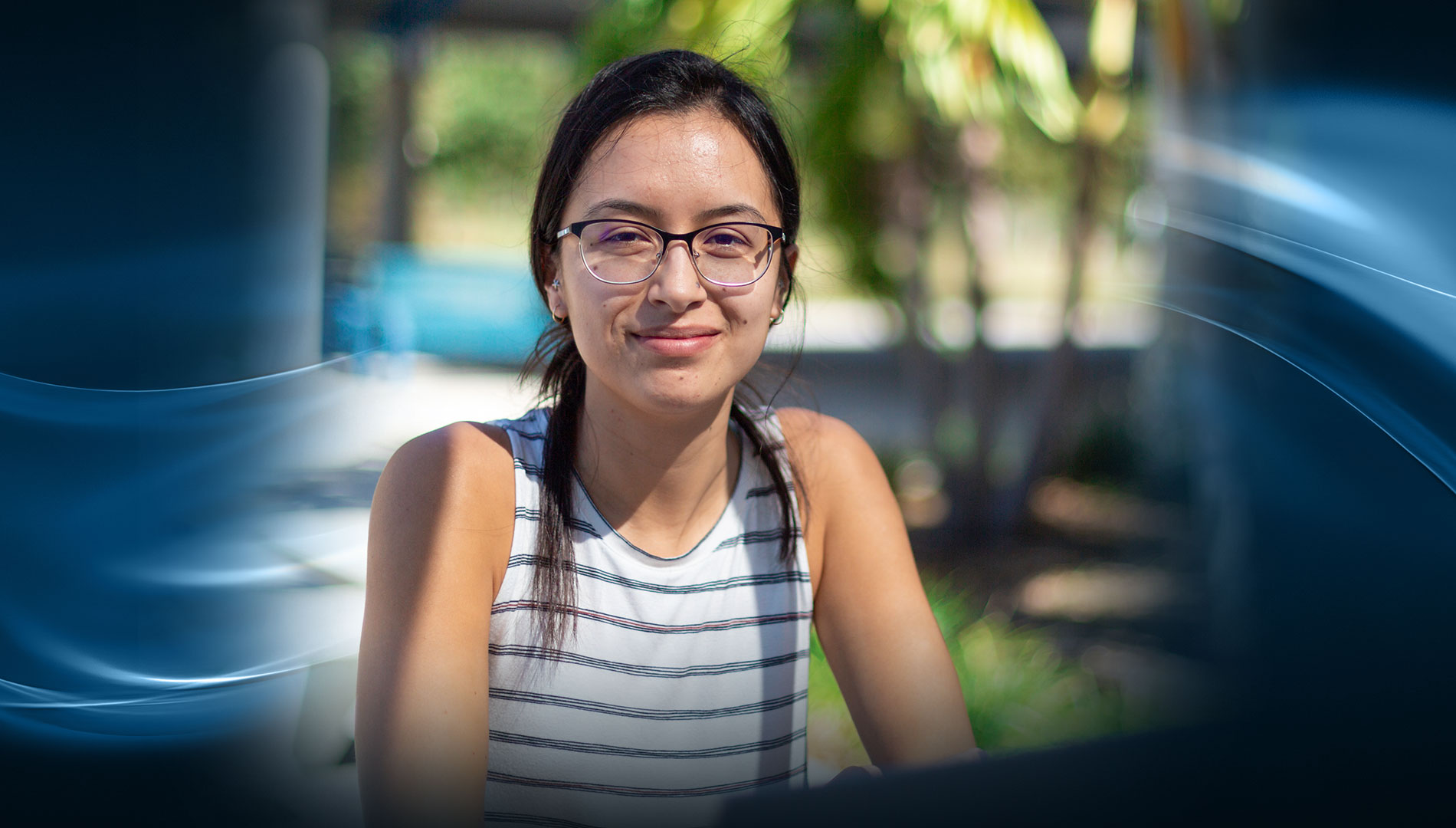 young female with glasses smiling about registering for fall class