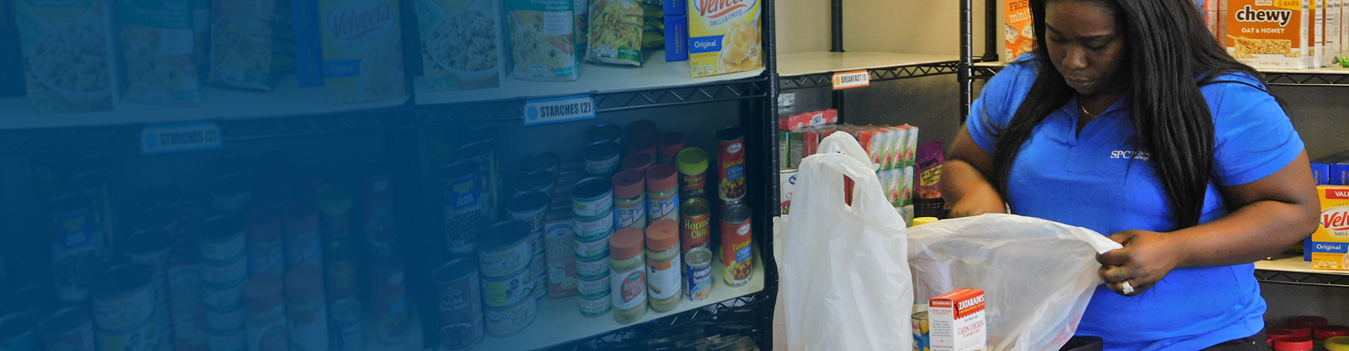 blue gradient on left with a picture of a student in a blue SPC tshirt holding a white bag of food
